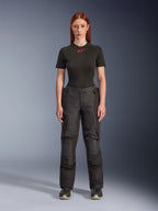 Alpinestars Stella Andes V4 Drystar® Pants, black women’s adventure touring motorcycle pants, shown on a model with a black Alpinestars t-shirt, featuring a technical textile design with cargo pockets and reinforced knee panels.