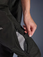 Alpinestars Woman Stella Andes V4 Drystar® Pants, Motorcycle Pants, Black, close-up of a hand opening the zippered thigh ventilation to reveal mesh lining for airflow, durable textile adventure gear
