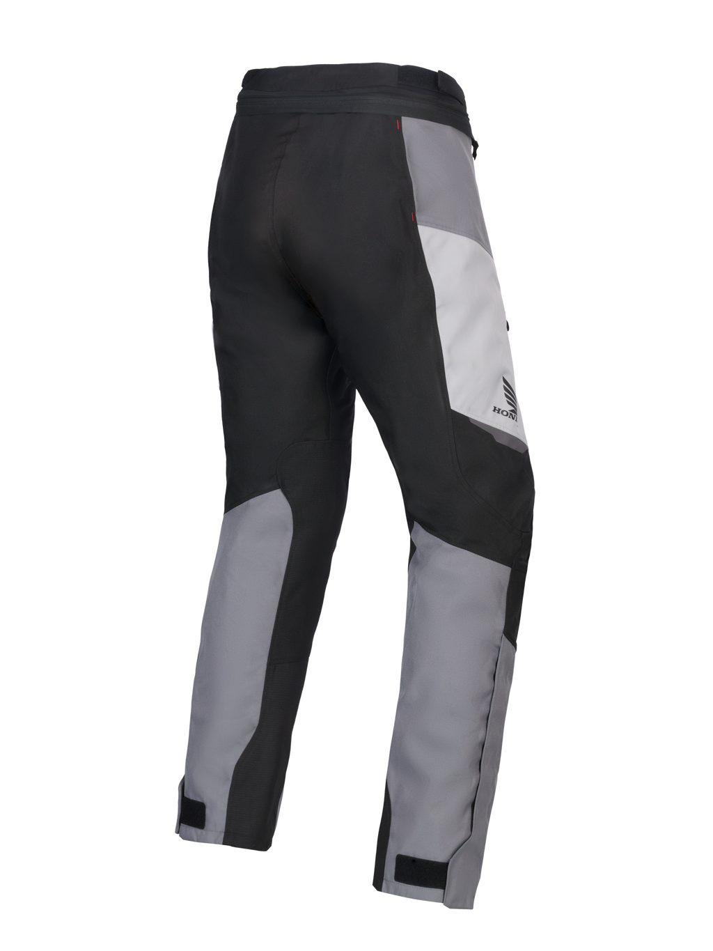 Alpinestars 2025 Honda Stella ST-1 Waterproof Pants para mujer, pantalones de motociclismo touring para mujer, gris hielo, gris oscuro y negro, vista trasera en tres cuartos que muestra la construcción textil duradera, paneles de bloques de color gris y negro, marca Honda en la cadera y cierres ajustables en los tobillos.