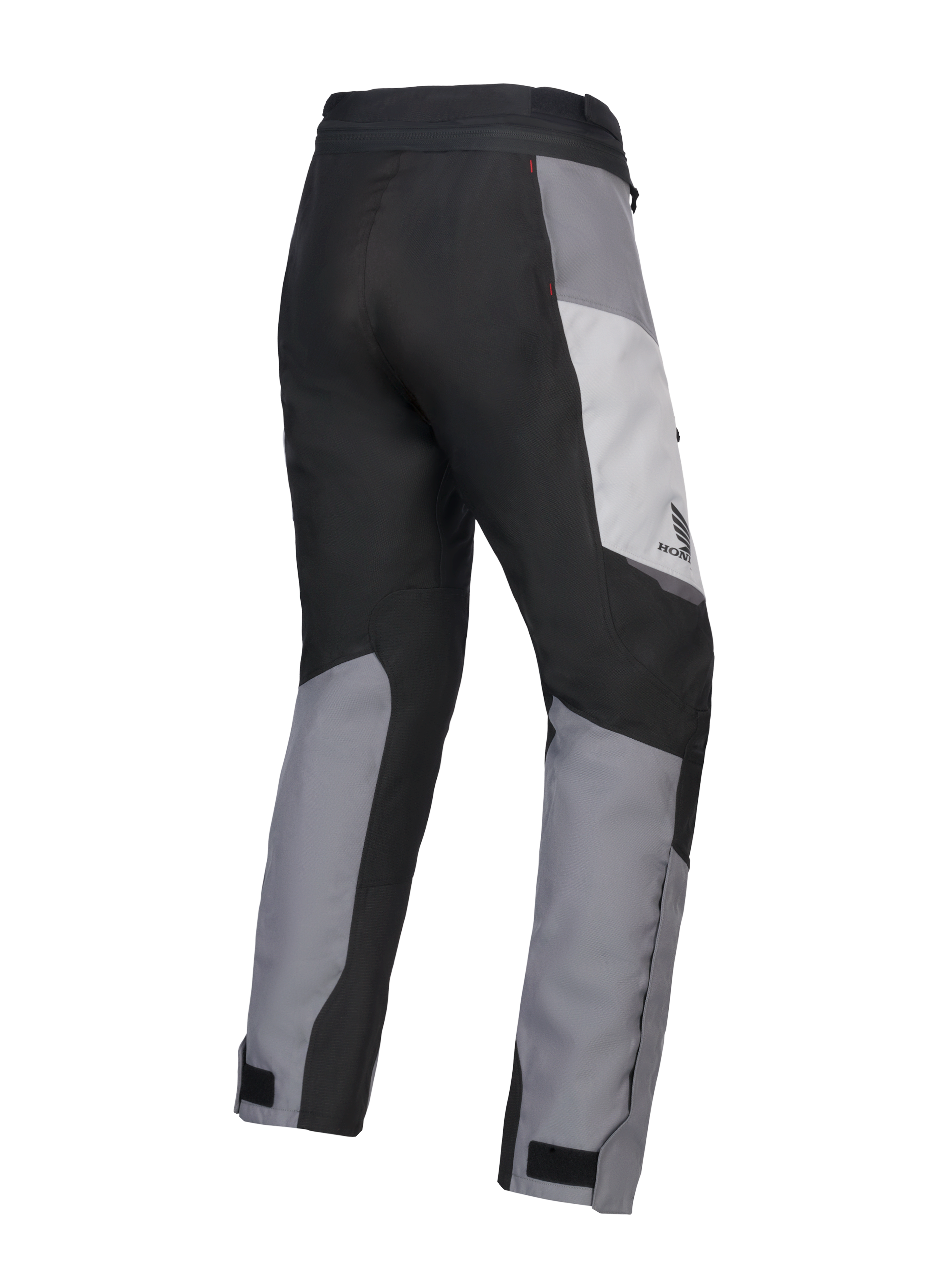 Alpinestars 2025 Honda Stella ST-1 Waterproof Pants para mujer, pantalones de motociclismo touring para mujer, gris hielo, gris oscuro y negro, vista trasera en tres cuartos que muestra la construcción textil duradera, paneles de bloques de color gris y negro, marca Honda en la cadera y cierres ajustables en los tobillos.
