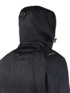 Alpinestars Morush Waterproof Parka, Black, close-up back view of the hood and shoulder area, featuring a stormproof hood system with snap button and a small Alpinestars logo, urban motorcycle streetwear style