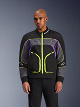 Alpinestars Unite Jacket, chaqueta urbana de moto para hombre, negra con detalles amarillo neón, morado y gris, cremalleras amarillas brillantes, logos en pecho y mangas, protección casual