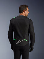 Chaqueta Alpinestars T-SPS Air V2, chaqueta textil para motocicleta, negro y verde flúor, vista posterior con grandes paneles de malla técnica para ventilación, logotipo blanco de Alpinestars en la parte inferior de la espalda, ajuste ergonómico de corte deportivo para conducción urbana