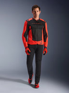 Alpinestars MM93 T-SPS Air V2 Jacket, Red Fluo and Black, worn by a model with matching red gloves and black pants, featuring Marc Marquez branding and the 93 logo, ventilated sport motorcycle jacket for urban riding