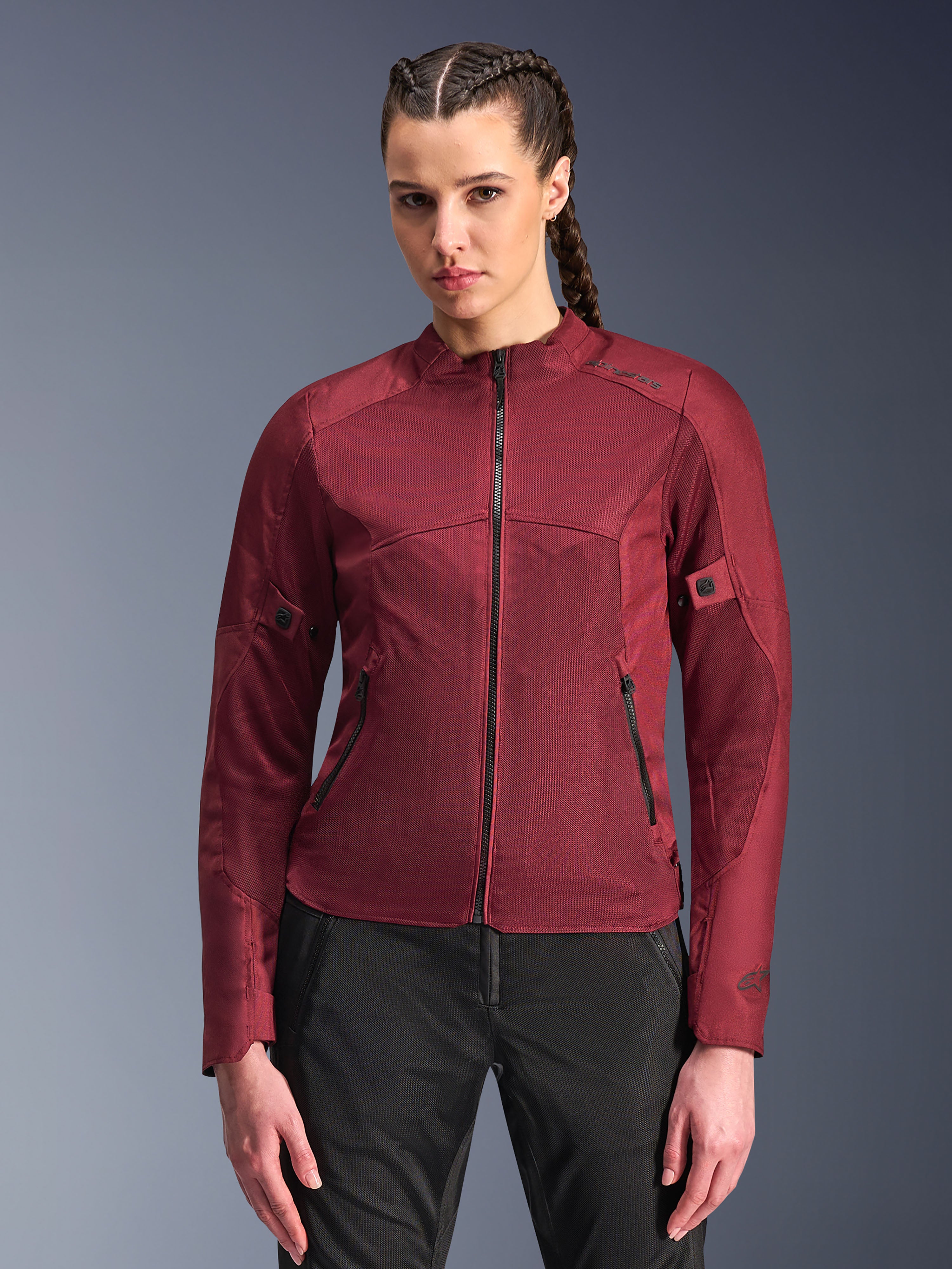 Alpinestars Stella C-1 Air Jacket, Women's Motorcycle Jacket, Burgundy Red, mesh panels for airflow, zippered front and pockets, fitted sporty design, worn by a model with black riding pants