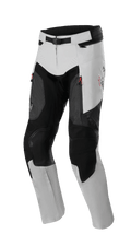 Alpinestars AMT 7 Air Pants, Adventure Touring Motorcycle Pants, Tan and Dark Shadow, featuring red zipper accents and MATRYX ventilation panels, reinforced knee protection, laser-perforated detailing, adjustable magnetic waist closure, modern design with textured panels