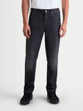 Alpinestars Flex-AST 8 Denim Pants, men's urban motorcycle riding jeans in used black, front view on a model wearing casual everyday apparel, AA certified single-layer stretch denim with protective features