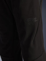 Alpinestars Aeroshell Airflow Pants, Black Motorcycle Pants, close-up view of the thigh area featuring a raised black ASTARS logo, lightweight stretch softshell material with ergonomic seam design