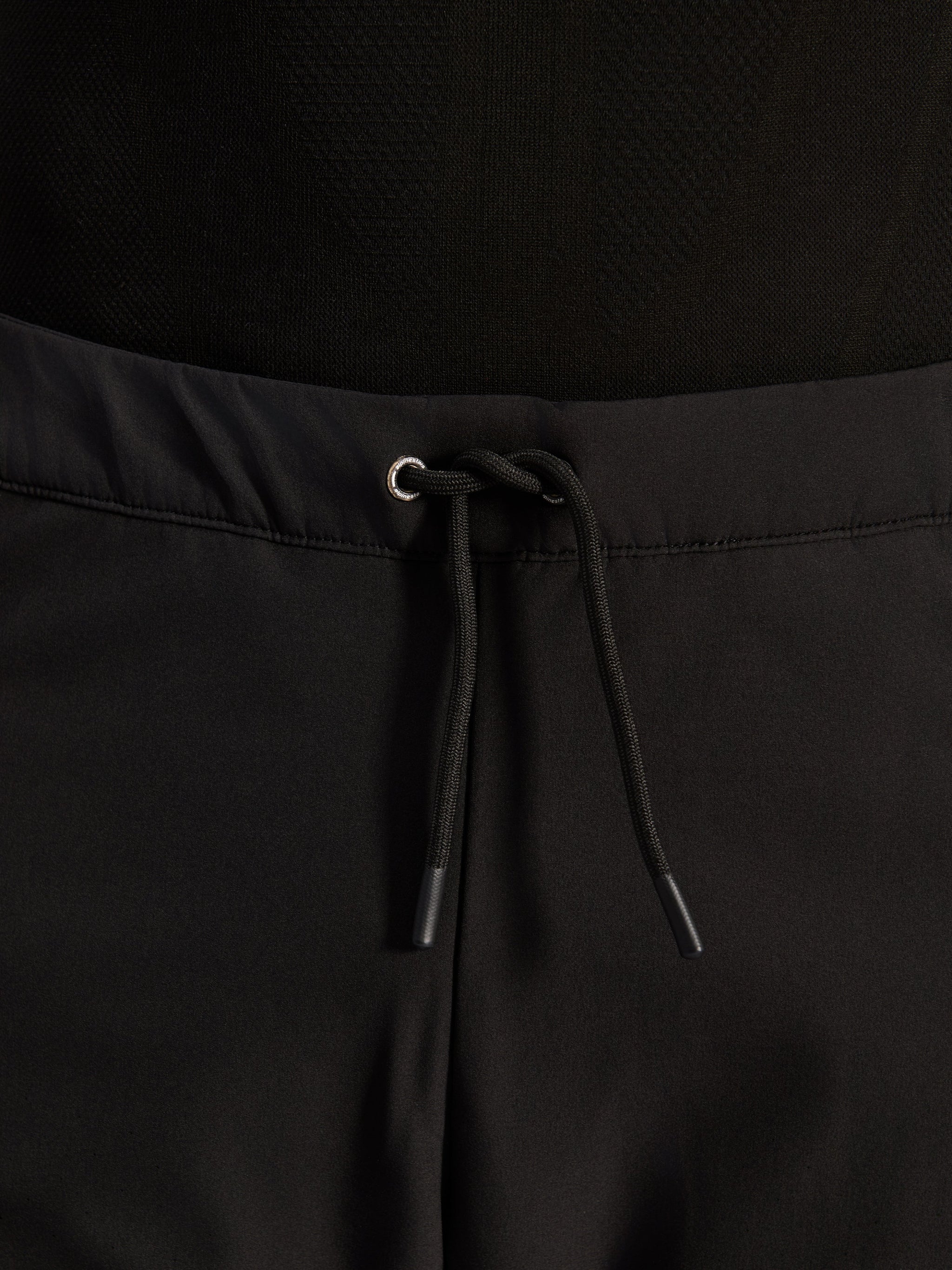 Alpinestars Aeroshell Airflow Pants, Black, close-up of waistband featuring adjustable internal elastic drawstring cord and silver eyelet detail, sport-touring motorcycle gear