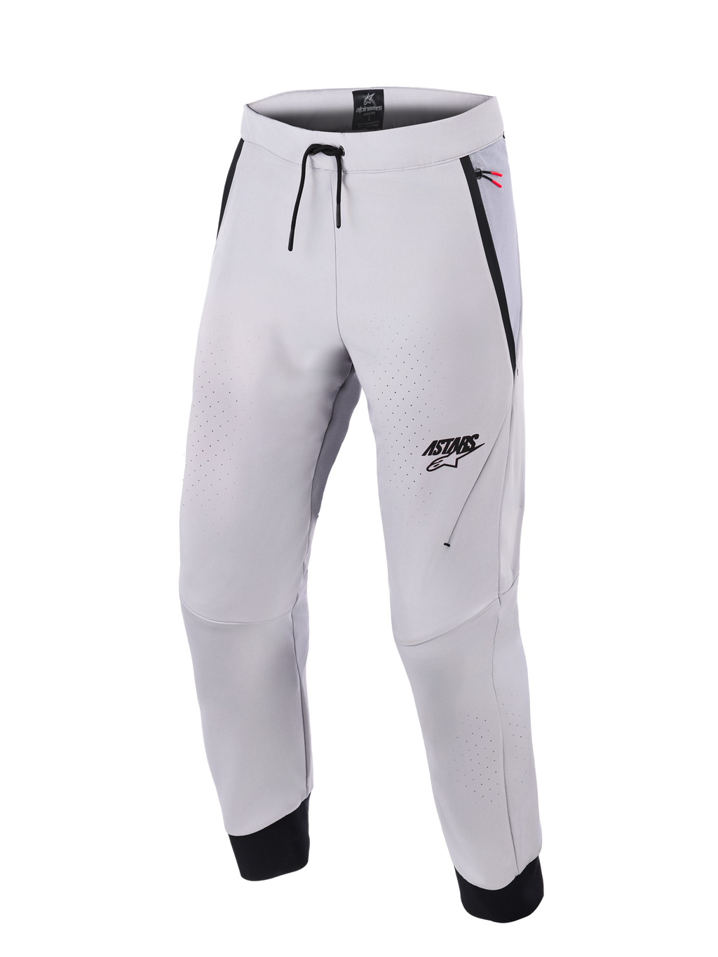 Pantalones Alpinestars Aeroshell Airflow, pantalones de moto en color gris medio, con zonas de ventilación perforadas con láser, logotipo ASTARS en el muslo izquierdo, cintura con cordón ajustable y puños negros en los tobillos, diseño técnico de softshell para conducción deportiva y urbana