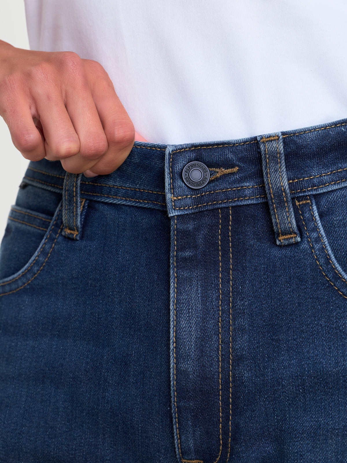 Alpinestars Stella Flex-AST 5 Denim Pants, women's urban motorcycle riding jeans, indigo washed blue, close-up view of the waistband, button closure, and single-layer stretch denim construction worn by a model