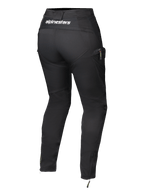 Pantalones Alpinestars Actea para mujer, negros, vista trasera con logotipo blanco en la cintura, silueta entallada con bolsillo lateral tipo cargo, cremalleras en los tobillos, modernos pantalones de conducción para moto