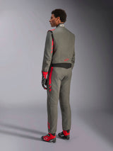 Alpinestars GP Race V3 Suit FIA, Anthracite Red racing suit, back view of model wearing the two-layer suit, red accents on shoulders and legs, paired with matching gloves and boots, professional auto racing gear