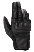 Alpinestars Phenom Leather Gloves, guantes de cuero para moto, color negro, vista superior que muestra la protección rígida perforada en los nudillos, dedos reforzados, inserciones elásticas de acordeón y construcción en piel de cabra de primera calidad.