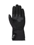 Guantes Alpinestars Wt-1 Drystar® térmicos, guantes de moto, negros, vista de la palma con zonas de agarre textil reforzadas, puño largo con logotipo blanco de Alpinestars en la correa, construcción resistente a la intemperie para conducción en carretera
