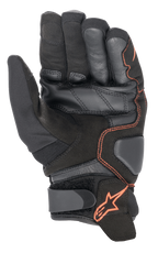 Guantes Alpinestars SMX-1 Drystar®, guantes de moto, negro y rojo flúor, vista de la palma que destaca la construcción de cuero y gamuza reforzados, zonas de aterrizaje acolchadas y correa de velcro en la muñeca con el logo de la estrella roja