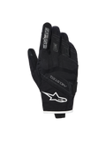 Guantes Alpinestars Stella Moblast Waterproof, guantes de moto para mujer, negros con detalles blancos, vista del dorso que muestra el logotipo de Alpinestars, la marca MO.ST.EQ. y protección suave en los nudillos.