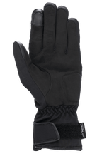 Guantes Alpinestars Stella SR-3 V2 Drystar® para mujer, negros, vista de la palma que muestra refuerzos de cuero sintético, punta del dedo índice compatible con pantallas táctiles, muñeca elástica y puño de guantelete con correa de Velcro ajustable y logotipo de Drystar.