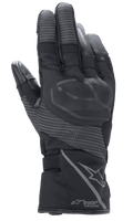 Guantes Alpinestars Stella Andes V3 Drystar para mujer, color Negro Antracita, vista del dorso con protección de nudillos integrada, paneles ripstop reflectantes, logotipo de Alpinestars y marca Drystar Performance en el puño, equipamiento de motociclismo adventure touring