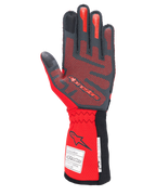 Guantes Alpinestars Tech-1 ZX V4, guantes de automovilismo, negros y rojos, vista de la palma con patrón de agarre de silicona 3D roja y etiquetas de homologación FIA/SFI en el puño, diseñados para alto rendimiento en deportes de motor