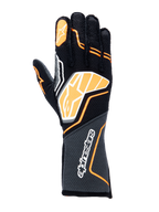 Guantes Alpinestars Tech-1 ZX V4, guantes de automovilismo, negros con detalles en naranja flúor y blanco, con un gran logotipo gráfico en el dorso de la mano, tejido con textura de panal en el puño, diseño geométrico deportivo para carreras profesionales