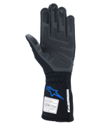 Guantes Alpinestars Tech-1 ZX V4, guantes de automovilismo, negro y azul, vista de la palma que muestra la tecnología de agarre de silicona 3D gris, con etiquetas de certificación FIA y SFI en el puño, protección profesional para deportes de motor