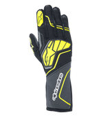 Guantes Alpinestars Tech-1 ZX V4, guantes de automovilismo, gris alquitrán, negro y amarillo fluorescente, con un gran logotipo de estrella amarilla en el dorso y marca blanca en el puño, tejido con textura de panal con detalles neón angulares, equipo profesional de automovilismo