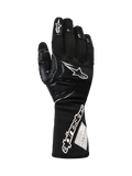 Alpinestars Tech-M V2 Gloves FIA, guantes de carreras para equipos de boxes en negro y blanco, con puño extendido, marca Alpinestars y etiqueta de certificación FIA, parches reforzados en nudillos y dedos para protección contra impactos, equipo profesional de automovilismo