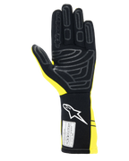 Alpinestars Tech-1 Start V4 Gloves FIA, guantes de automovilismo, amarillo fluorescente y negro, vista de la palma con patrones de agarre de silicona, puño extendido con logotipo blanco y etiqueta de certificación FIA