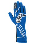Alpinestars Tech-1 Start V4 Gloves FIA, guantes de automovilismo, azul real, con detalles geométricos blancos y logotipos de estrellas negros, puño extendido con texto vertical de Alpinestars, construcción ligera sin costuras, equipo de carreras profesional con certificación FIA