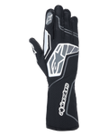 Guantes Alpinestars Tech-1 KX V4, guantes de karting, negro antracita, vista posterior que muestra la malla transpirable de doble capa, detalles gráficos en gris y blanco, marca prominente de Alpinestars en la muñeca y los nudillos, equipamiento especializado de carreras