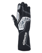 Guantes Alpinestars Tech-1 KX V4, guantes de karting, negro antracita, vista posterior que muestra la malla transpirable de doble capa, detalles gráficos en gris y blanco, marca prominente de Alpinestars en la muñeca y los nudillos, equipamiento especializado de carreras