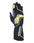 Guantes Alpinestars Tech-1 KX V4, guantes de karting, gris, negro y amarillo fluorescente, vista del dorso con construcción de malla transpirable, logotipo grande de Alpinestars en amarillo, nombre de la marca en blanco en la muñeca, estrella amarilla en el dedo índice, diseño deportivo moderno