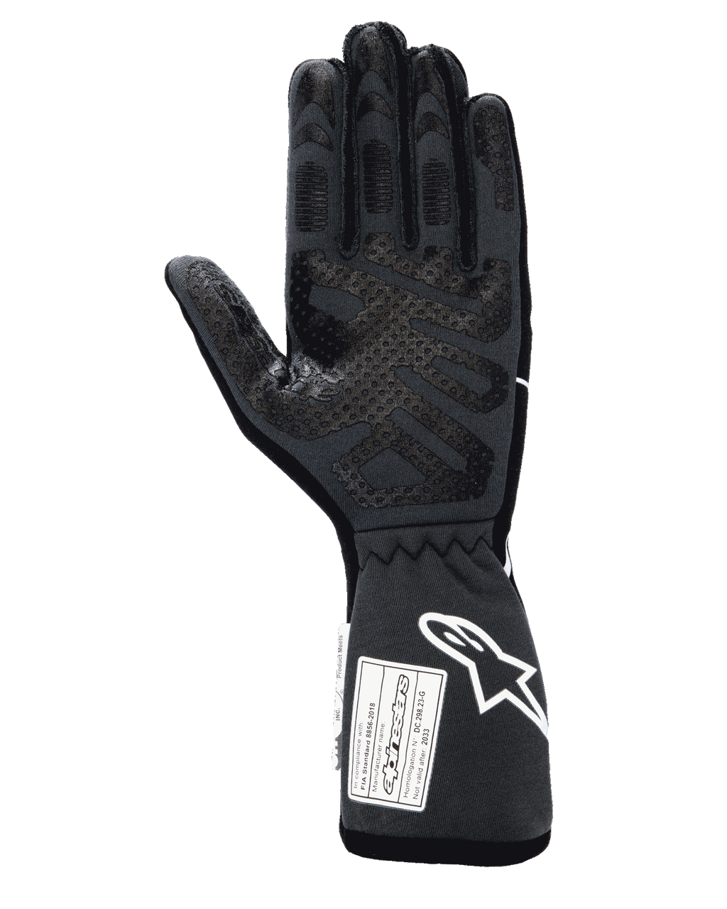 Guantes Alpinestars Tech-1 Race V4, guantes profesionales de automovilismo, color negro y gris, vista de la palma con patrones de agarre de silicona en los dedos y la palma, puño extendido con logotipo blanco de Alpinestars y etiquetas de certificación FIA/SFI