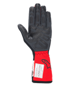 Guantes Alpinestars Tech-1 Race V4, guantes de automovilismo, negro y rojo, vista de la palma que resalta los patrones de agarre de silicona en los dedos y la palma, puño rojo extendido con el logotipo de Alpinestars y la etiqueta de certificación FIA, equipamiento de automovilismo de alto rendimiento