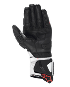 Guantes Alpinestars GP Pro R4, guantes de competición tipo gauntlet, negros y blancos, vista de la palma que muestra la construcción de cuero de alto rendimiento, puño perforado con deslizadores rígidos y detalles del logo en rojo