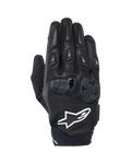 Guantes Alpinestars SP X 7, guantes cortos deportivos para moto, negros y blancos, con construcción de cuero perforado, protección de nudillos en TPU de doble densidad y logotipo de estrella Alpinestars en blanco, diseñados para conducción deportiva en carretera