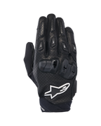 Guantes Alpinestars SP X 7, guantes cortos deportivos para moto, negros y blancos, con construcción de cuero perforado, protección de nudillos en TPU de doble densidad y logotipo de estrella Alpinestars en blanco, diseñados para conducción deportiva en carretera