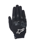 Guantes Alpinestars SP X 3, guantes de moto de puño corto en negro y blanco, vista superior que muestra la protección de nudillos de TPU de doble densidad, el gran logotipo de estrella blanca y protectores de dedos, diseñados para conducción deportiva y en carretera.