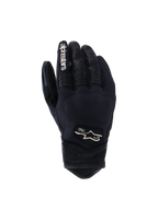 Alpinestars Tracker Gloves, Motorcycle Gloves, Black, backhand view showing stretch textile construction, perforated leather details on fingers and wrist, white branding on index finger, Alpinestars logo with 1963 on the back, padded knuckle area, short cuff urban design