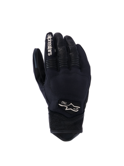 Alpinestars Tracker Gloves, Motorcycle Gloves, Black, backhand view showing stretch textile construction, perforated leather details on fingers and wrist, white branding on index finger, Alpinestars logo with 1963 on the back, padded knuckle area, short cuff urban design