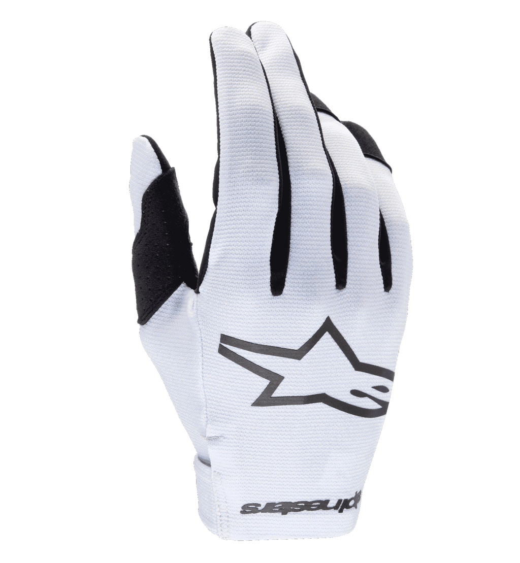 Guantes Alpinestars Radar 2025, guantes de motocross, blancos y negros, con dorso sintético texturizado y un logotipo de estrella negro prominente, detalles negros entre los dedos, cierre de muñeca sin costuras con marca, diseño ligero y ajustado para carreras todoterreno
