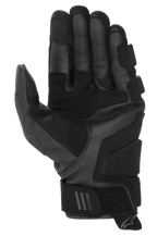 Guantes Alpinestars Phenom Leather Air, negros, vista de la palma con confección en cuero de cabra de primera calidad, zonas de agarre reforzadas y cierre de velcro ajustable en la muñeca.