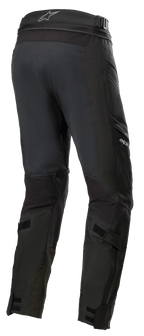 Alpinestars Road Tech GORE-TEX Pants Short, Black, rear 3/4 view featuring waist connection zipper, adjustable calf straps, and ballistic nylon reinforcements, waterproof adventure touring gear