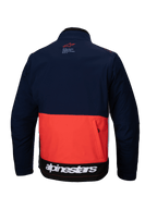 Chaqueta Alpinestars Lite-Dura Softshell en azul marino, naranja y blanco, vista trasera que muestra un diseño de bloques de color, gran bolsillo de almacenamiento trasero con cremallera y logotipo de Alpinestars blanco en el dobladillo inferior