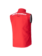 Chaleco Softshell Techstar Juvenil Alpinestars, chaleco de motocross, rojo brillante, vista trasera con gran logotipo de Alpinestars en blanco en la parte superior de la espalda, diseño softshell sin mangas con cuello alto para protección contra el viento.