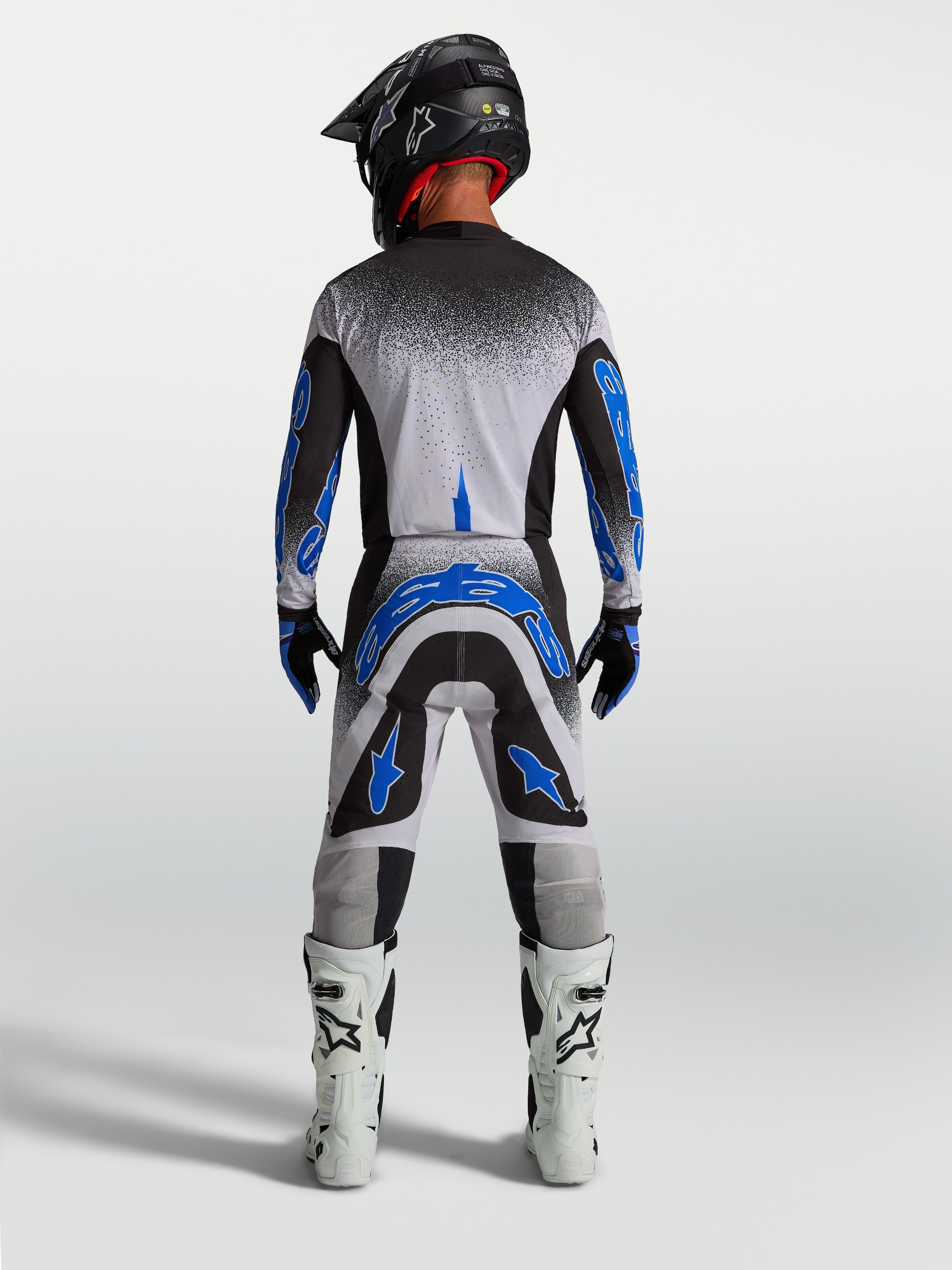 Pantalones Alpinestars Supertech Hiten AFD, equipo de motocross azul y blanco para hombre, vista trasera de ajuste atlético
