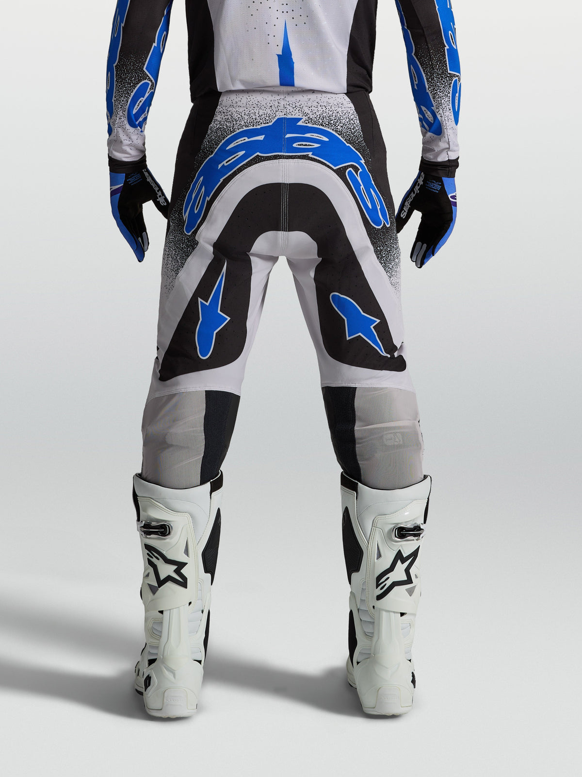 Alpinestars Supertech Hiten AFD Motocross Pants for men in Black and Blue, featuring an athletic race-proven fit.