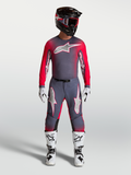Alpinestars Supertech Hiten AFD Gear Set y pantalones, equipo de motocross profesional en gris y rojo flúor.