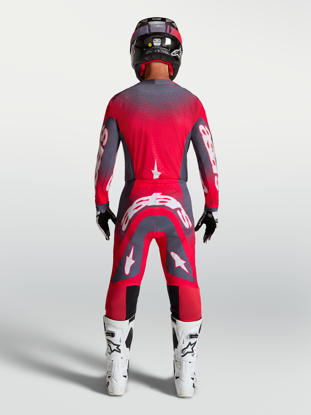 Supertech Hiten AFD Gear Set y pantalones de Alpinestars, equipo de motocross rojo fluorescente y gris, vista trasera